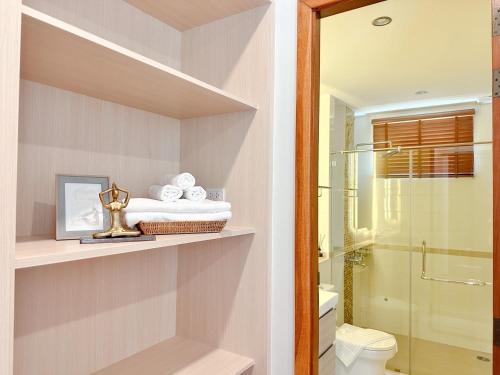 a bathroom with a shower and a toilet at La Nissta Villa 4bdr pool Villa Phuket in Koh Lone