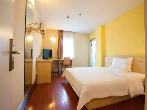 Ένα ή περισσότερα κρεβάτια σε δωμάτιο στο 7 Days Inn Nanjing Gaochun Metro Station