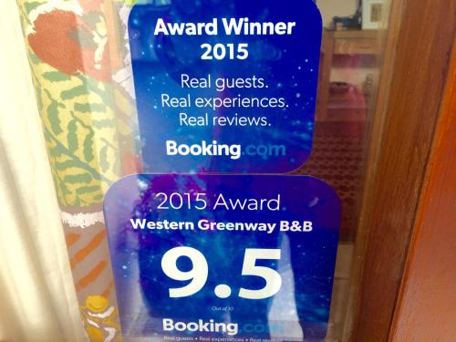 a sign on a door that reads award winner requests real experiencesreal reviews at Western Greenway B&B in Newport