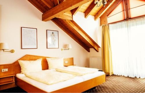 מיטה או מיטות בחדר ב-Sporthotel Schönblick