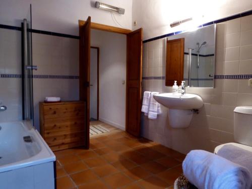 a bathroom with a sink and a toilet at Manyolas 93 in Alaró