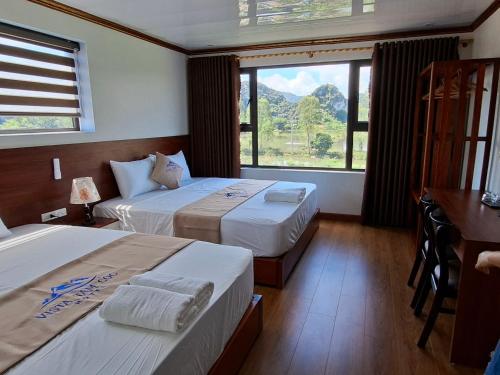 Postel nebo postele na pokoji v ubytování Vista Tam Coc Hotel