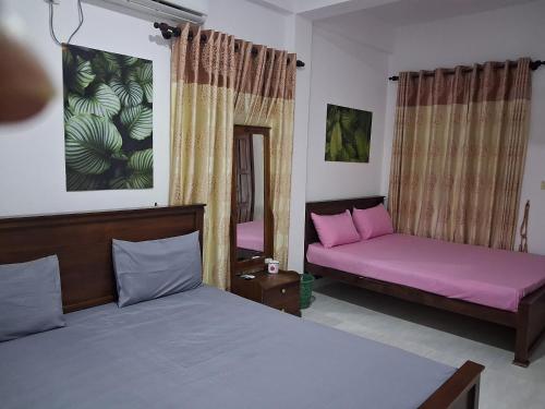Llit o llits en una habitació de Surf reef beach