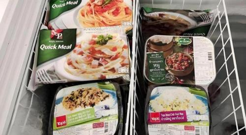 three packages of food are in a refrigerator at Iyara Residence in Trat