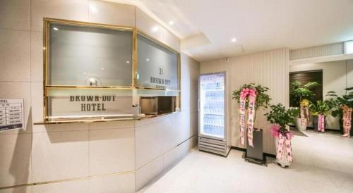 a restaurant lobby with a sign that reads promote just hotel at Changwon Brown dot Hotel Palyong in Changwon
