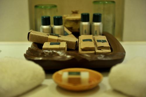 a close up of a group of bottles on a table at Tanjung Rhu Resort in Tanjung Rhu 