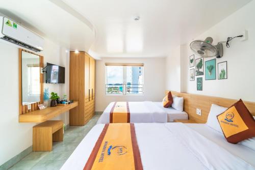 Ένα ή περισσότερα κρεβάτια σε δωμάτιο στο Sea Dragon Hotel Cát Bà & Aparment