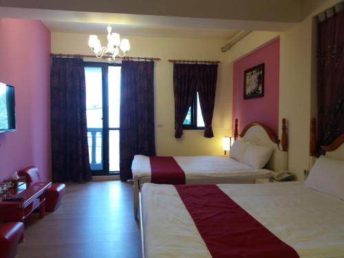 Ένα ή περισσότερα κρεβάτια σε δωμάτιο στο Money B&B