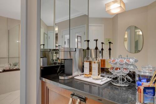 a counter with bottles and glasses on it in a kitchen at Aura Studio at MGM Signature FREE Valet Parking in Las Vegas