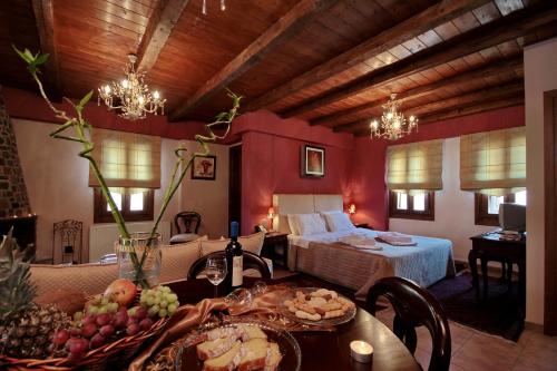 Postel nebo postele na pokoji v ubytování Menalia Villas & Suites ΚΤΗΜΑ ΚΟΥΜΠΟΥΡΗ