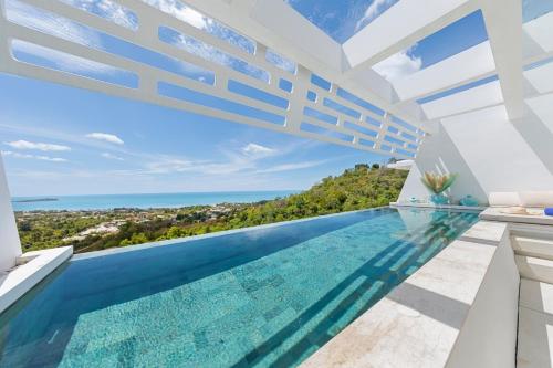 a pool in a house with a view at Aqua Villas Seaview Chaweng Noi in Nathon Bay
