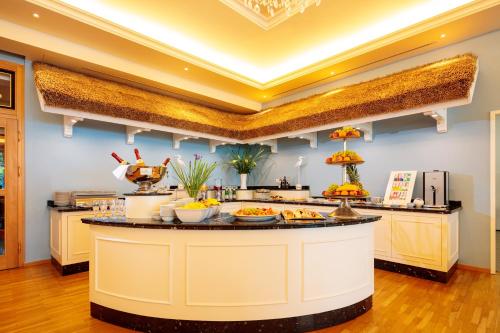 a breakfast bar with food on top of it at INSELHOTEL Potsdam in Potsdam