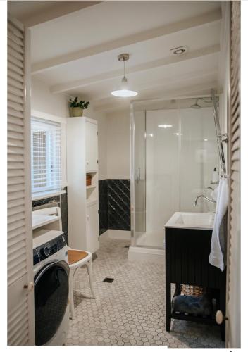 a bathroom with a sink and a tub and a shower at Olive Cottage Rankin in Bathurst