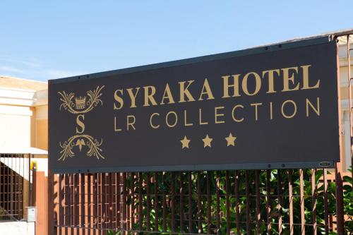a sign for a syra hotel and l hr collection at Syraka Hotel LR Collection in Siracusa