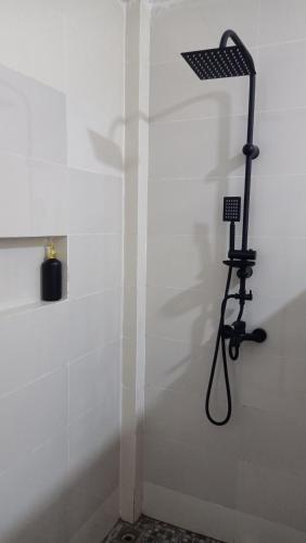 a shower in a bathroom with a shower at Bale Hotel & Cowork in Kuta Lombok