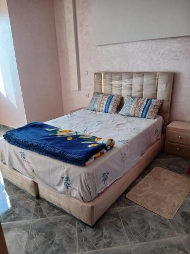 Una cama o camas en una habitación de Zina résidence