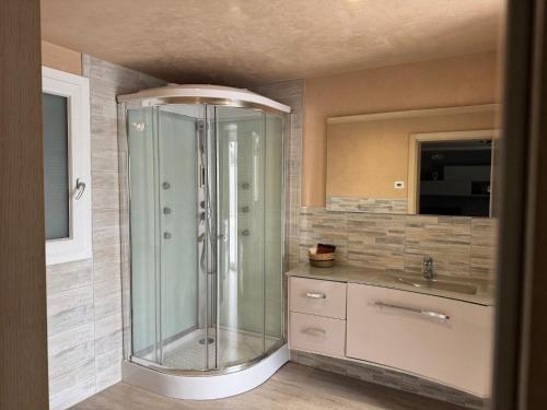 a bathroom with a shower and a sink at Locazione Turistica da Cinzia in Mezzavia