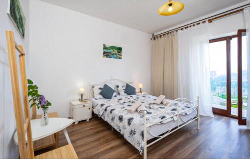 Ένα ή περισσότερα κρεβάτια σε δωμάτιο στο Sablic Apartmani