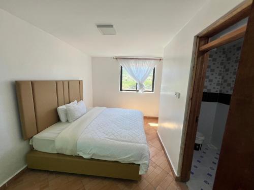 Ένα ή περισσότερα κρεβάτια σε δωμάτιο στο Mara Balanite Hotel