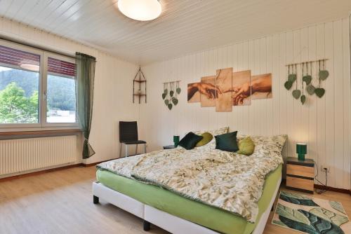 Postel nebo postele na pokoji v ubytování Wohlfühlwohnung nahe Basel und der Natur des Jura