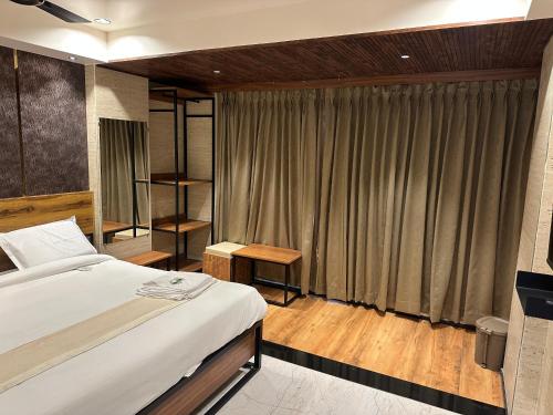 Postel nebo postele na pokoji v ubytování Hotel Keys Delight