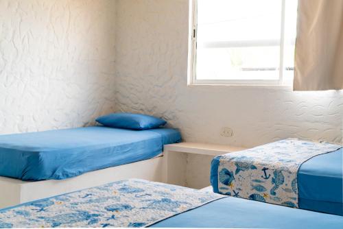 Giường trong phòng chung tại Kuruba beach home stays