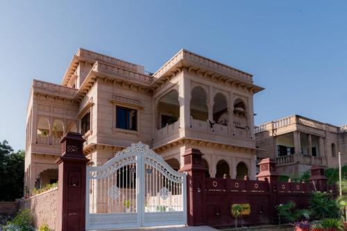 a large house with a gate in front of it at The heritage 100 in Jodhpur