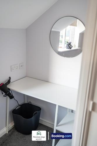 a white desk with a mirror in a room at Charming Entire House By Newman Stays Short Lets & Serviced Accommodation Bingham With Free WiFi, Smart TV & Great Location in Bingham