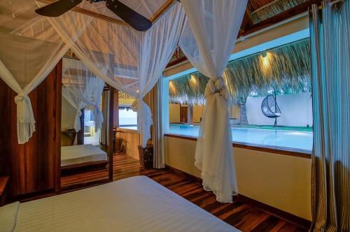 Giường trong phòng chung tại Green Organic Villas