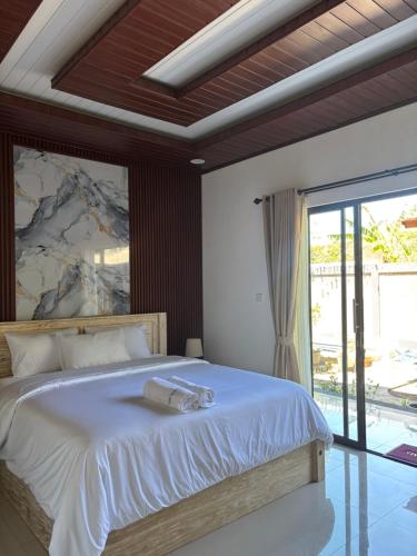 Ένα ή περισσότερα κρεβάτια σε δωμάτιο στο The Sundara Amed