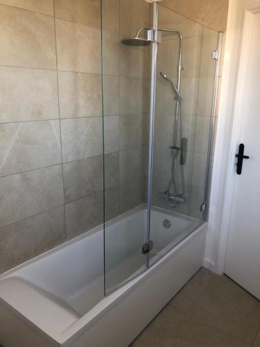 a shower with a glass door in a bathroom at Montpellier - Corum - Louis Blanc in Montpellier