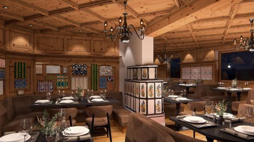 a rendering of a restaurant with tables and chairs at MyGoodLife Hotel & Bar in Gerlos
