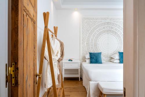 a bedroom with a bed and a pair of skis at Kostis Parthenis Residence in Malia