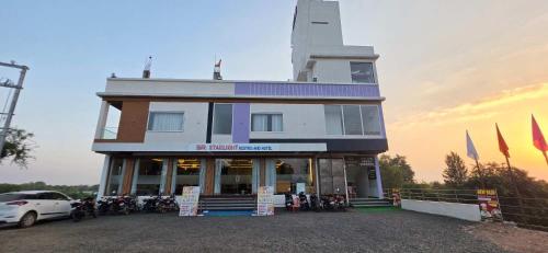 a building with a lighthouse on top of it at Starlight Restro and Hotel in Hoshangābād
