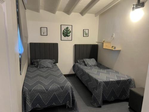 Postel nebo postele na pokoji v ubytování Casa Florez