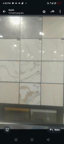 a window with white tiles on a wall at Tetebatu River Side BUNGALOWs in Tetebatu