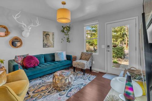 a living room with a blue couch at 5 min to DT-Multicade Arcade-Scenic-Nature Trails in Nashville
