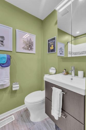 a bathroom with a white toilet and a sink at 5 min to DT-Multicade Arcade-Scenic-Nature Trails in Nashville