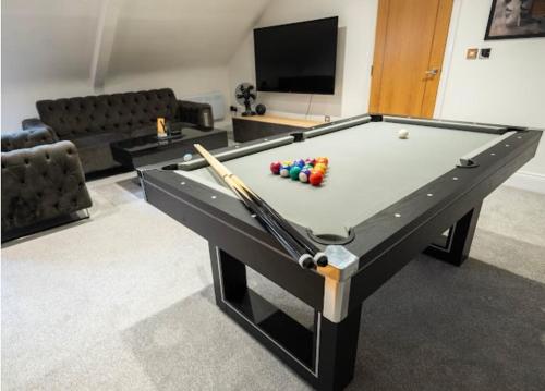 a pool table with billiard balls on it in a room at Spacious Two Bed Central Sunniside Penthouse Apartment in Sunderland