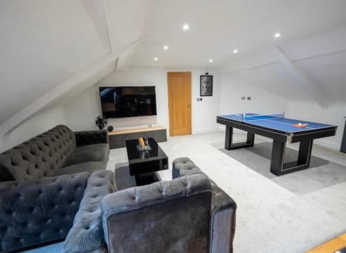 a living room with a ping pong table at Spacious Two Bed Central Sunniside Penthouse Apartment in Sunderland