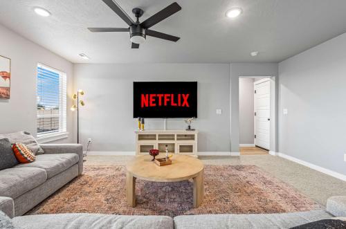 a living room with a couch and a tv at Spacious 5BR - Gamer Room - Hot Tub & Basketball in Star