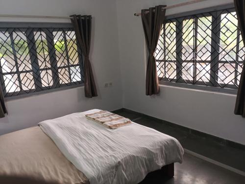 Ένα ή περισσότερα κρεβάτια σε δωμάτιο στο Peace Villa