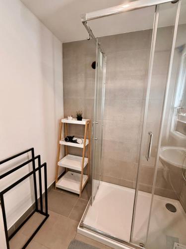 a bathroom with a shower and a sink at P&S Home in Nordstemmen