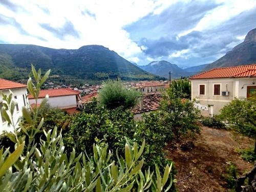 a view of a town with mountains in the background at Leonidio Downtown Haven in Leonidion