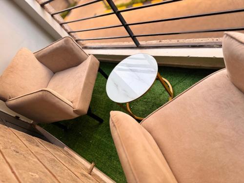 Ein Sitzbereich in der Unterkunft El luxe Homes Muthiga