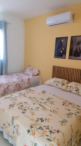 En eller flere senge i et værelse på Residência Lima 1