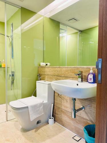 a bathroom with a sink and a toilet and a mirror at Soho Star Suites near by Klcc in Kuala Lumpur