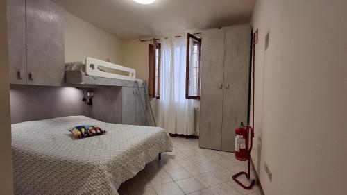 a hospital room with a bed and a window at Cavallo Blu in Clusane sul Lago