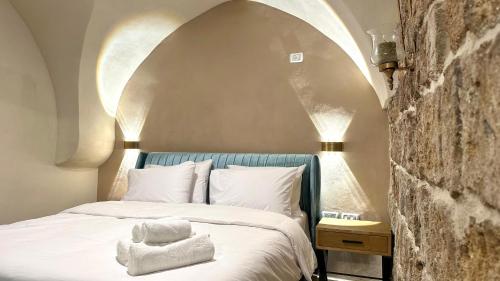 Ένα ή περισσότερα κρεβάτια σε δωμάτιο στο Knight House Akko