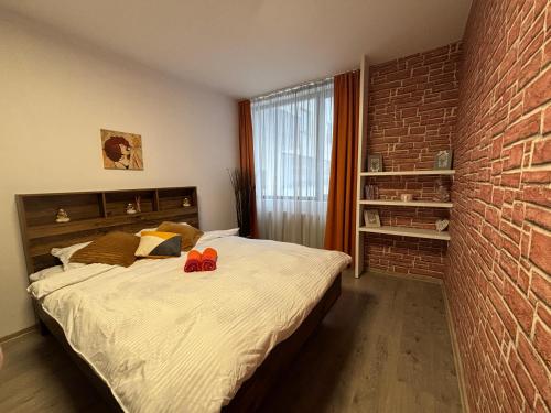 En eller flere senge i et værelse på Bob Residence- Chic Penthouse